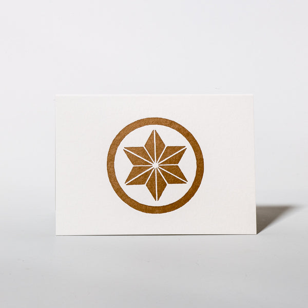 Weihnachtskarte mit bronzenem Stern im Buchdruckverfahren von ni yui.