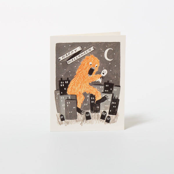 Grußkarte zu Halloween von Rifle Paper Co. mit orangefarbenem Monster.
